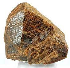 Monazite: A rare-earth phosphate mineral.